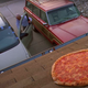Aerial shot of garage roof with pepperoni pizza on the shingles; Walter enters his car in the driveway below